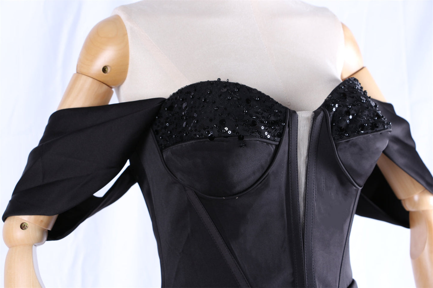  Black off-the-shoulder gown with embellishments