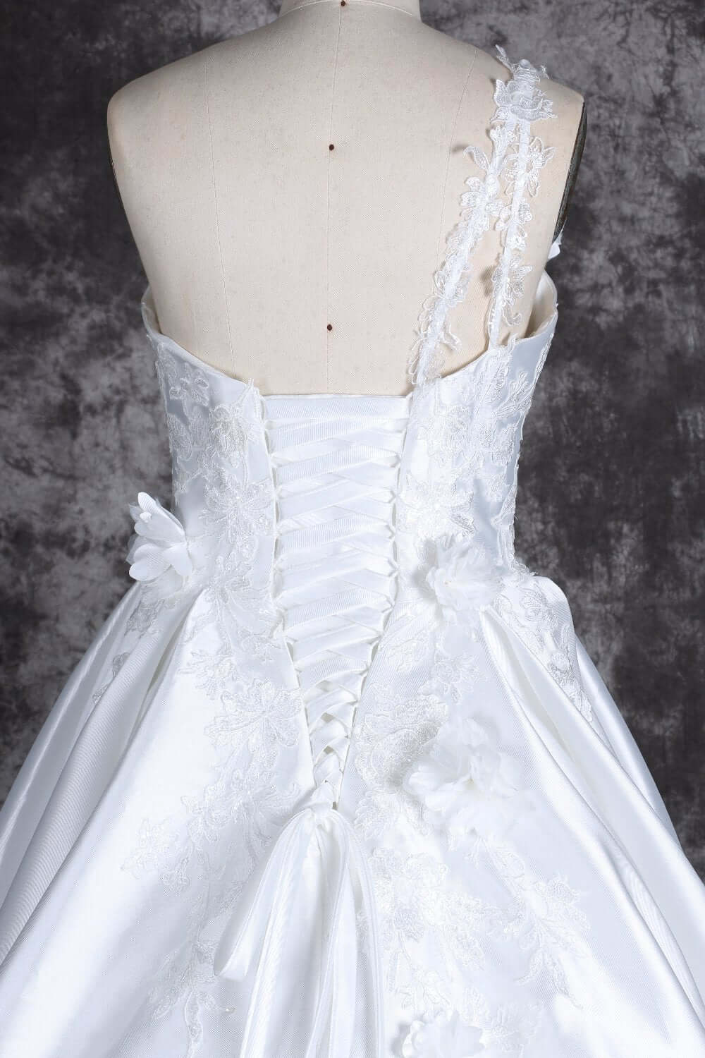 Romantic one-shoulder bridal gown with lace details