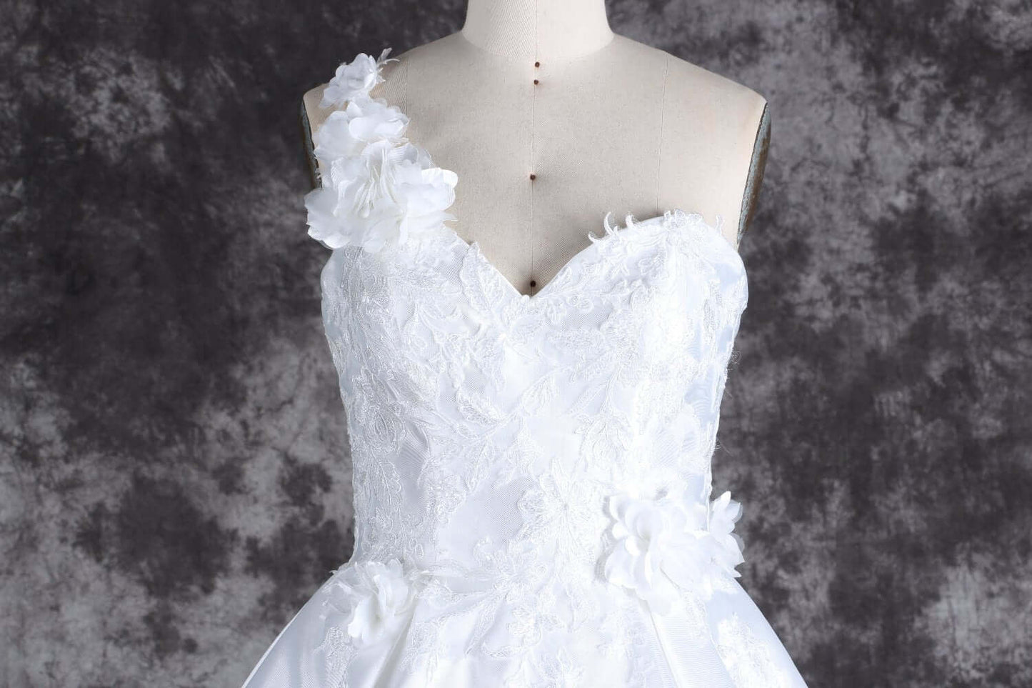 Romantic one-shoulder bridal gown with lace details