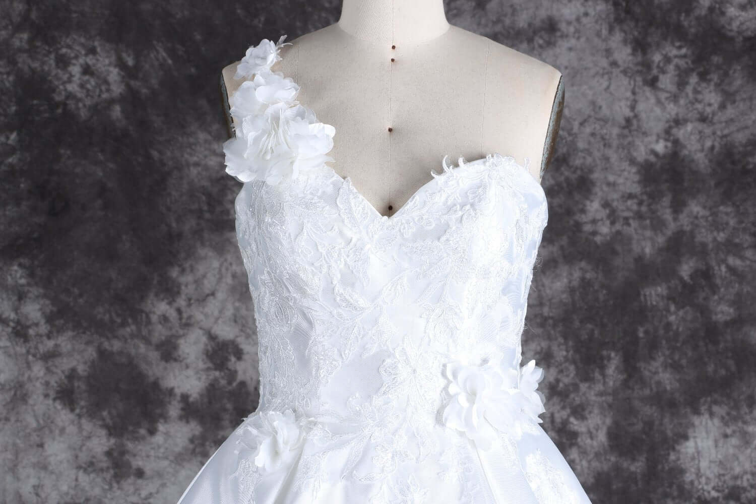 Romantic one-shoulder bridal gown with lace details